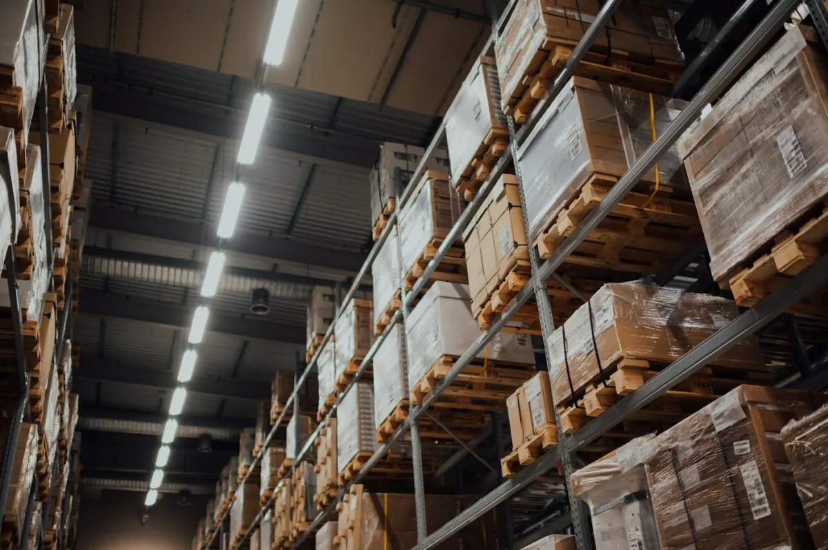 Warehouse aisle with shelves of boxed stock