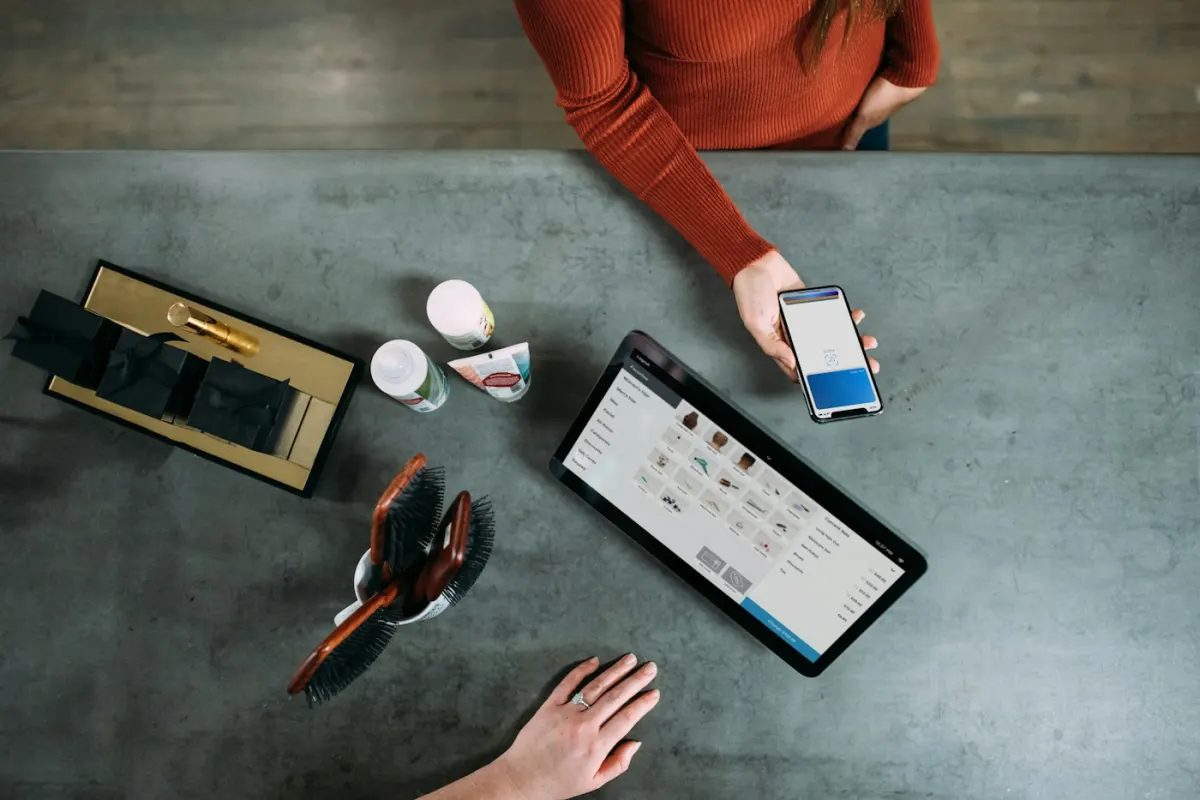 Business customer placing an order on a tablet and phone
